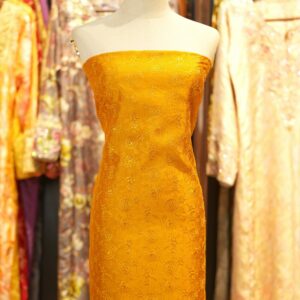 Golden mustard pure silk fabric with floral embroidery and subtle zari detailing