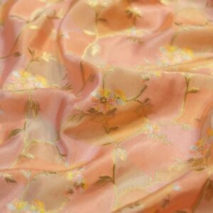 Blush peach Rangkaat silk fabric with multicolored floral zari weaving and soft pastel highlights