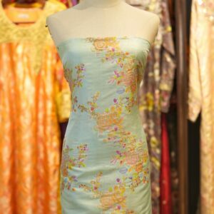 Mint green pure silk fabric with pastel floral motifs and golden zari weave