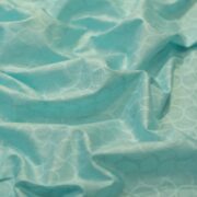 Aqua blue pure cotton jacquard fabric with circular geometric weave