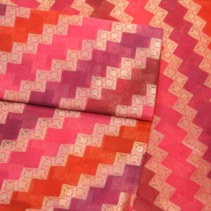 Luxurious pure organza fabric in gradient rangkaat tones with golden zigzag floral-bordered Zari weave.