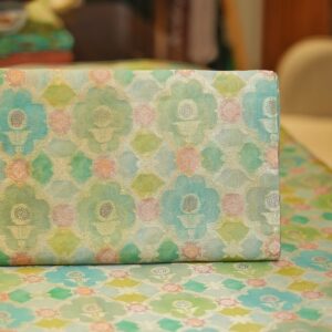 Pure organza silk Rangkaat fabric in aqua and gold tones with floral zari pattern