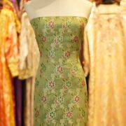 Green khaddi chiffon fabric with multicolored floral boota and hand-brush dye finish with zari highlights.