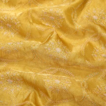 Golden yellow pure organza fabric with circular floral embroidery and delicate leafy weaves