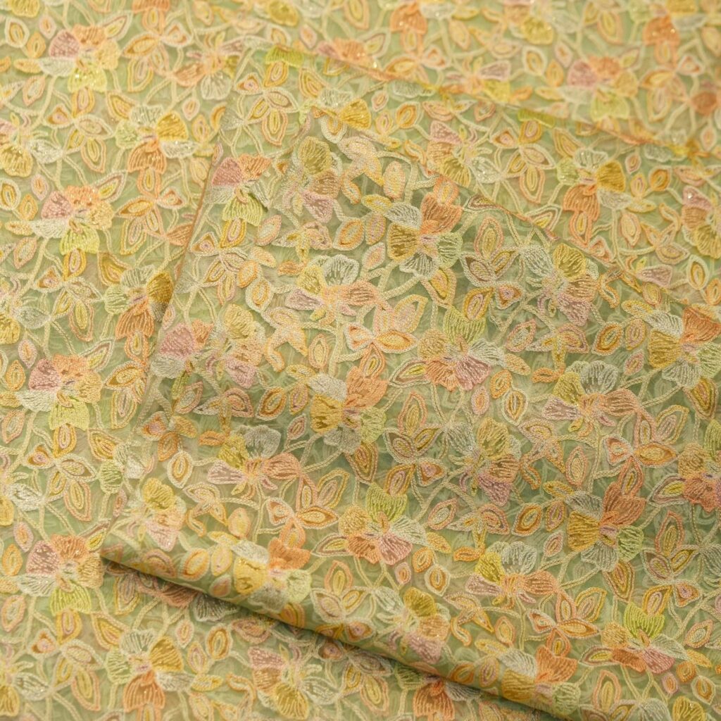 Pastel hand-brushed pure organza fabric with floral aari embroidery and intricate jaal design