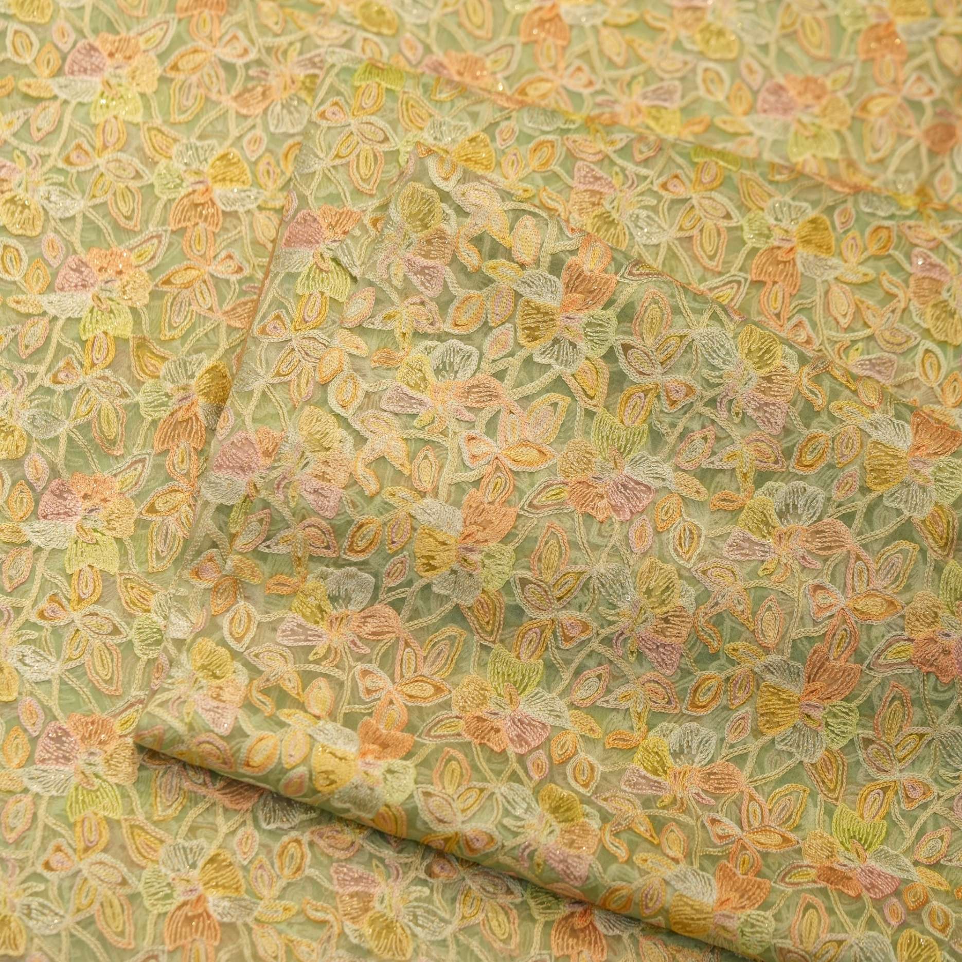 Pastel hand-brushed pure organza fabric with floral aari embroidery and intricate jaal design