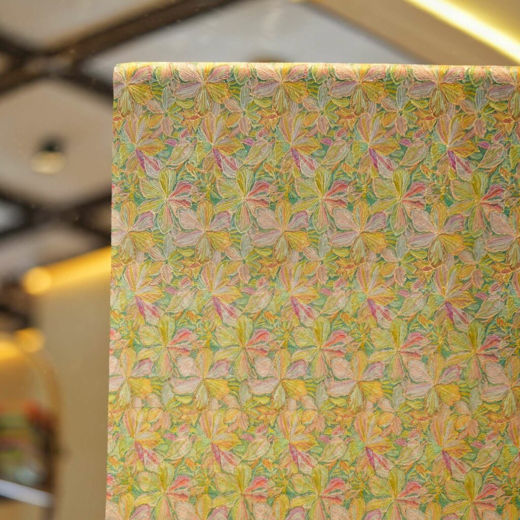 Heavy floral jaal embroidery on pure organza fabric with pastel thread and golden Zari highlights
