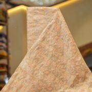 Golden tissue organza fabric with soft pastel floral embroidery and hand-dyed shading – luxury fabric for couture