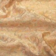 Golden tissue organza fabric with soft pastel floral embroidery and hand-dyed shading – luxury fabric for couture