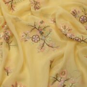Yellow organza fabric with multicolor floral embroidery and sequin embellishments – luxury festive fabric