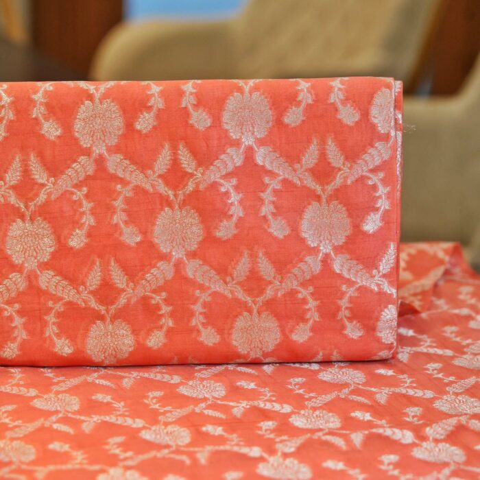 Coral pure organza fabric with silver zari floral jaal weave – luxury couture fabric