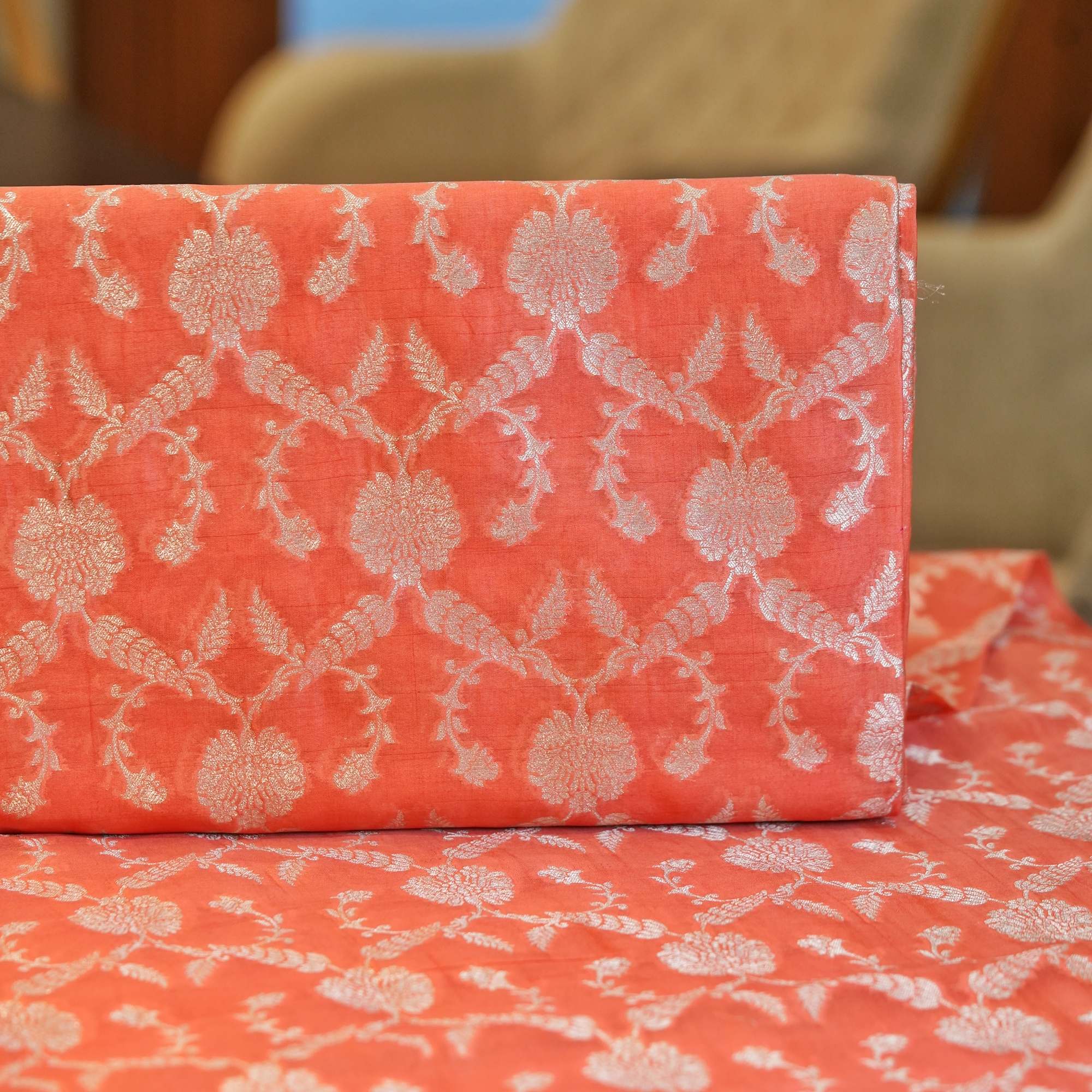 Coral pure organza fabric with silver zari floral jaal weave – luxury couture fabric