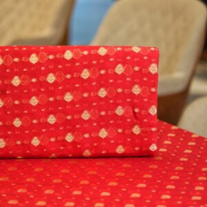 Rich red pure organza fabric with golden zari woven leaf motifs