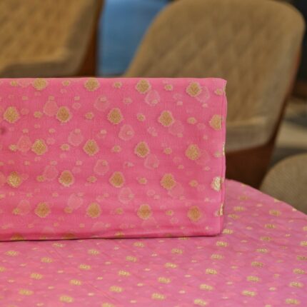 Elegant pink pure organza fabric with golden zari woven floral butas