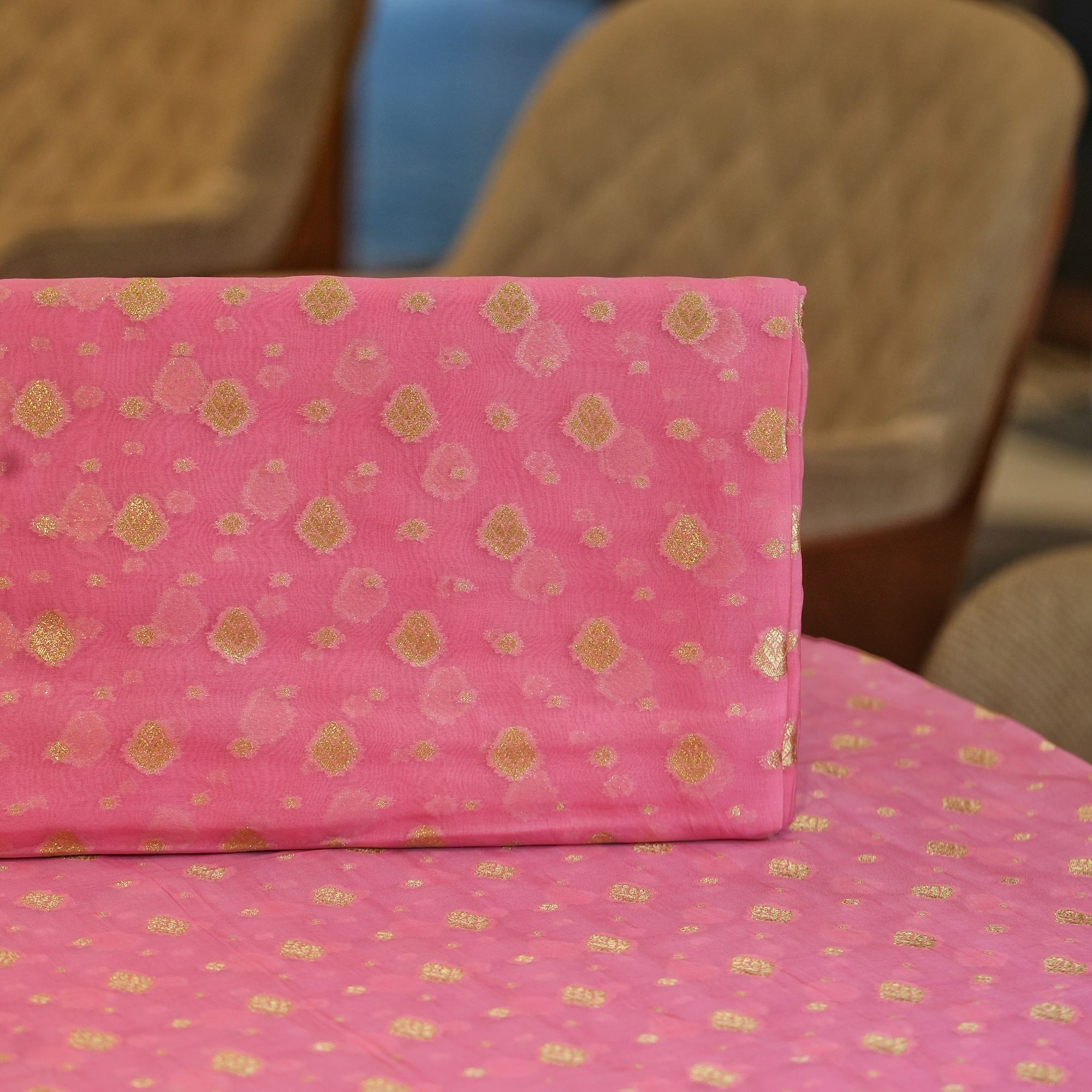 Elegant pink pure organza fabric with golden zari woven floral butas