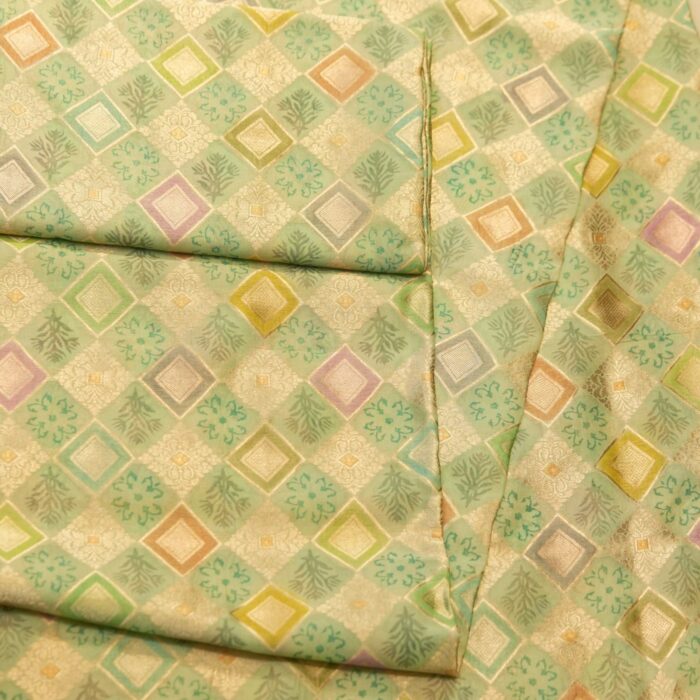 Pure organza fabric with pastel geometric zari weave and floral block motifs