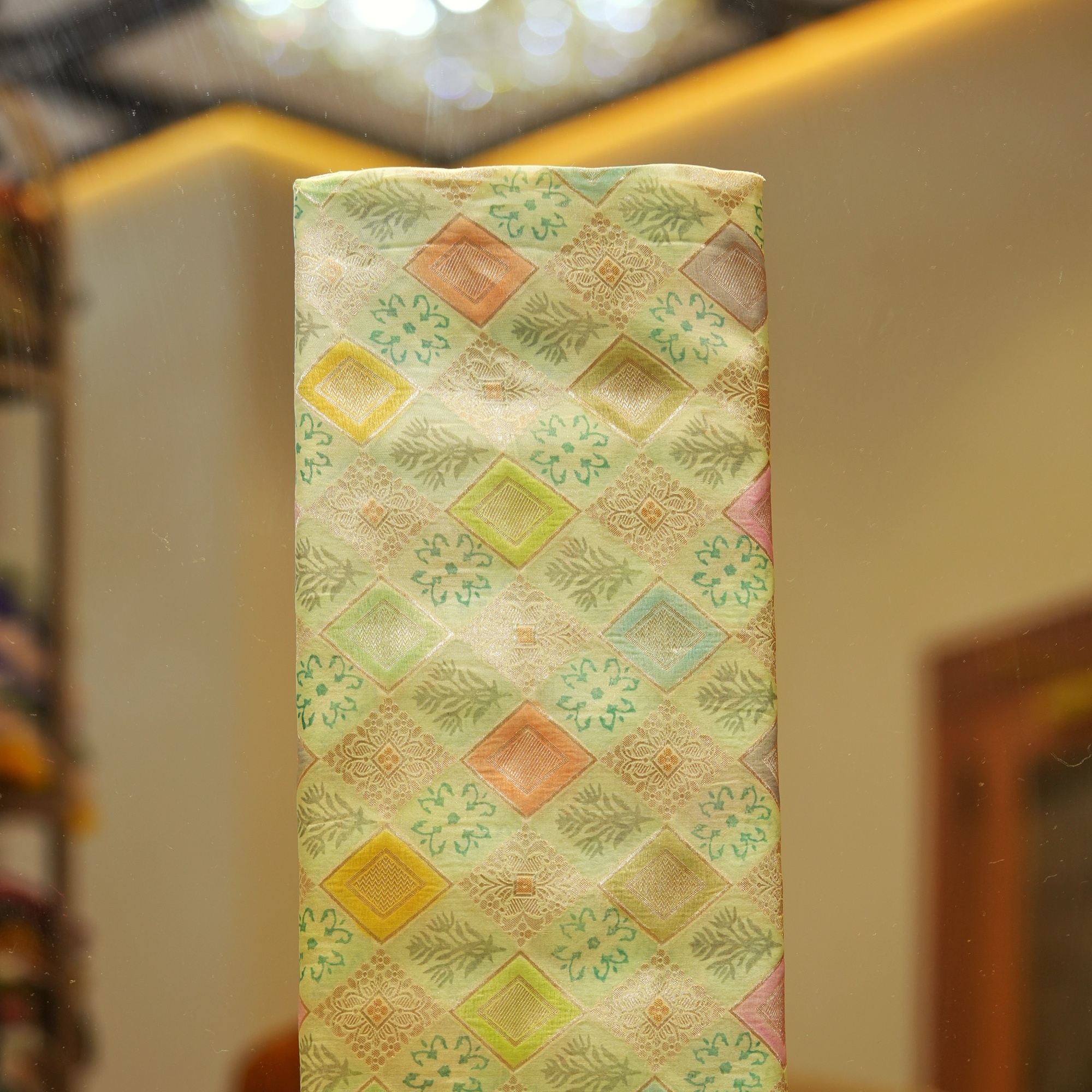 Pure organza fabric with pastel geometric zari weave and floral block motifs