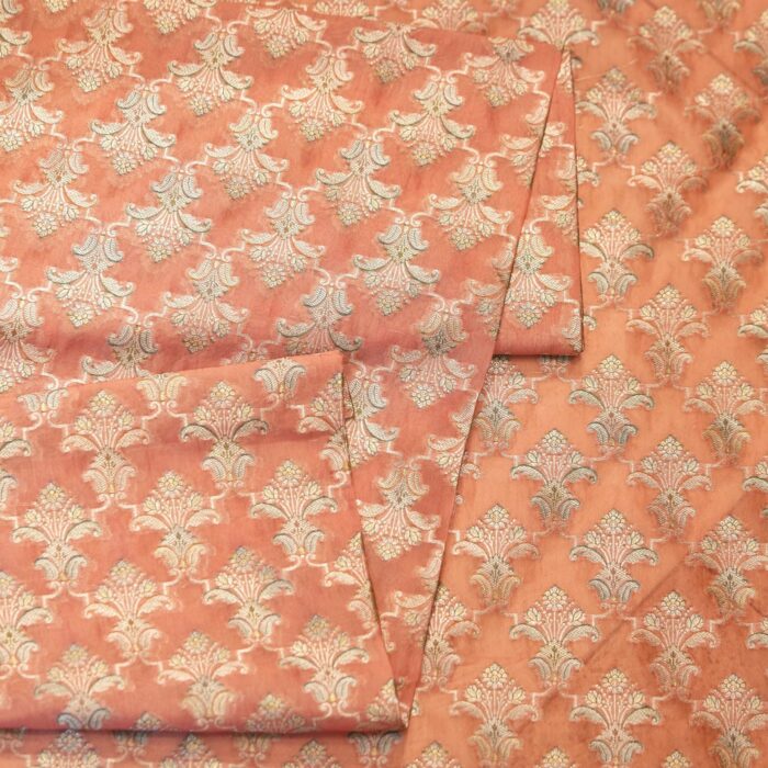 Pure organza fabric with golden Zari jaal and soft hand-brushed dye highlights