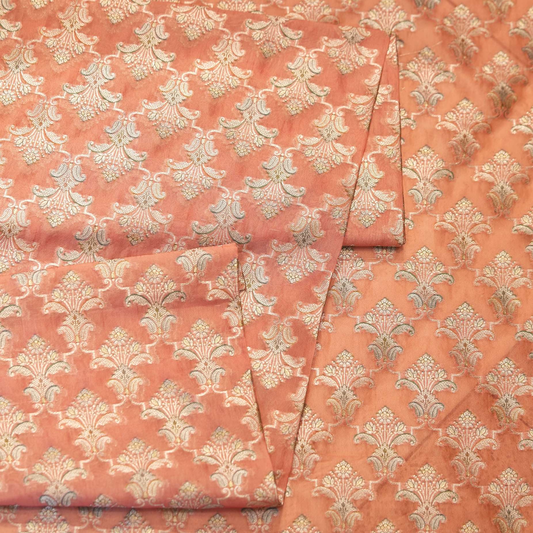 Pure organza fabric with golden Zari jaal and soft hand-brushed dye highlights