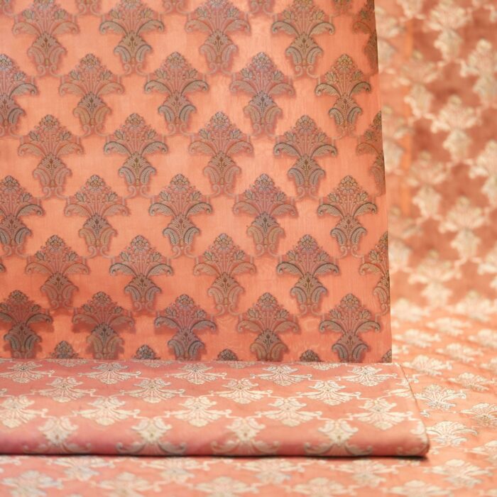 Pure organza fabric with golden Zari jaal and soft hand-brushed dye highlights