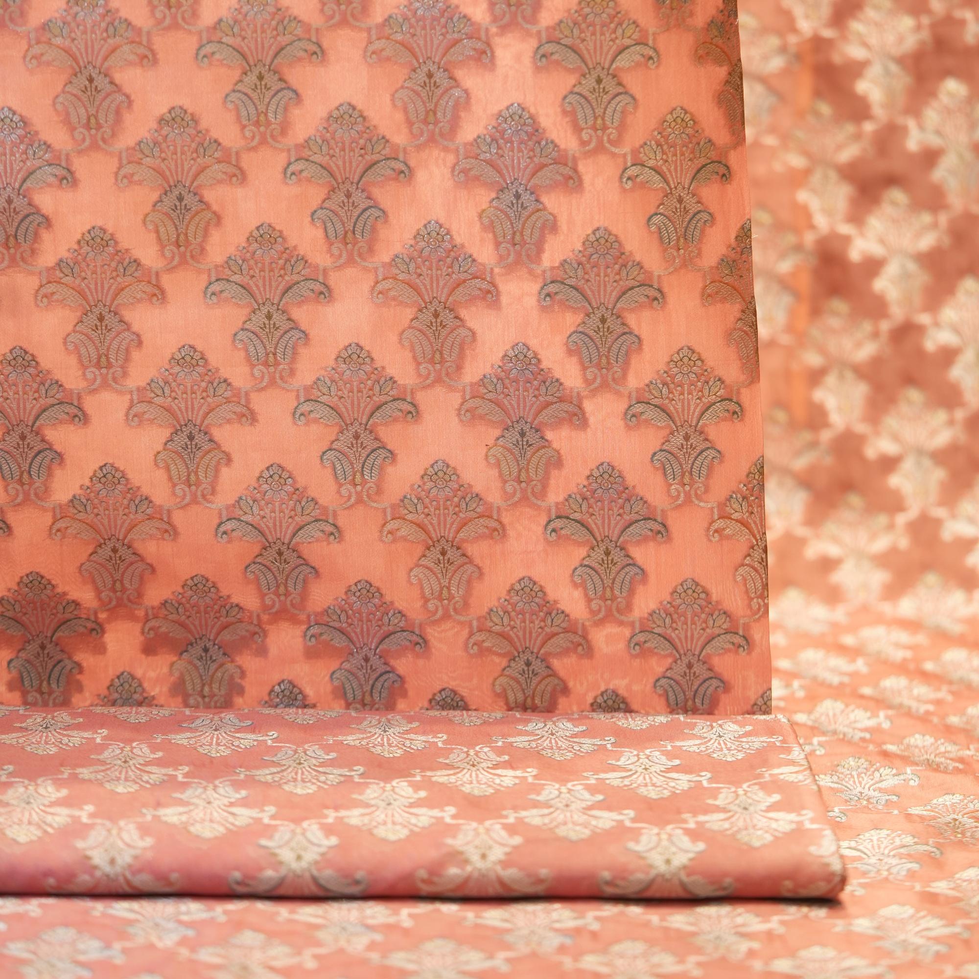 Pure organza fabric with golden Zari jaal and soft hand-brushed dye highlights