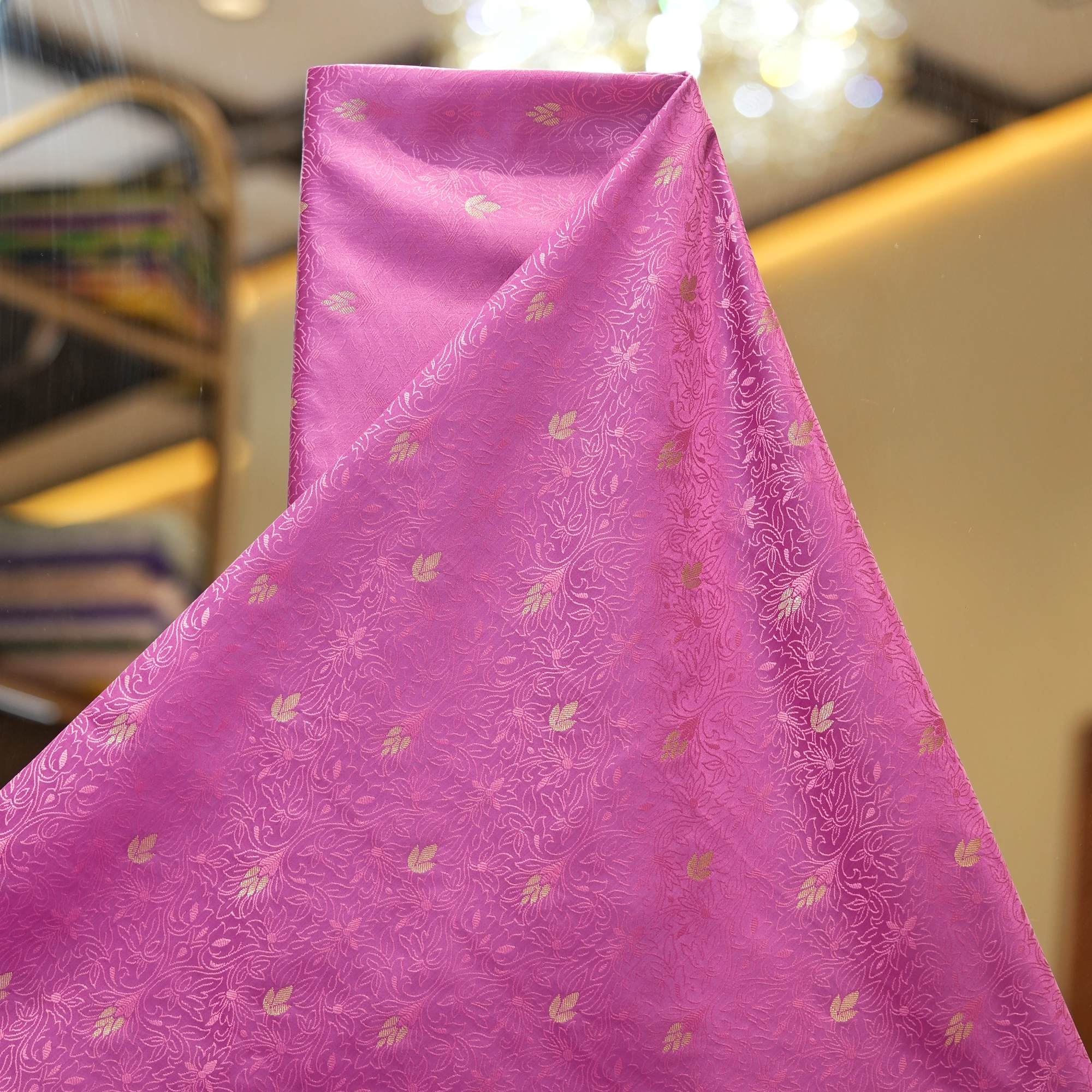 Magenta jamawar silk fabric with golden zari buti and intricate woven base texture