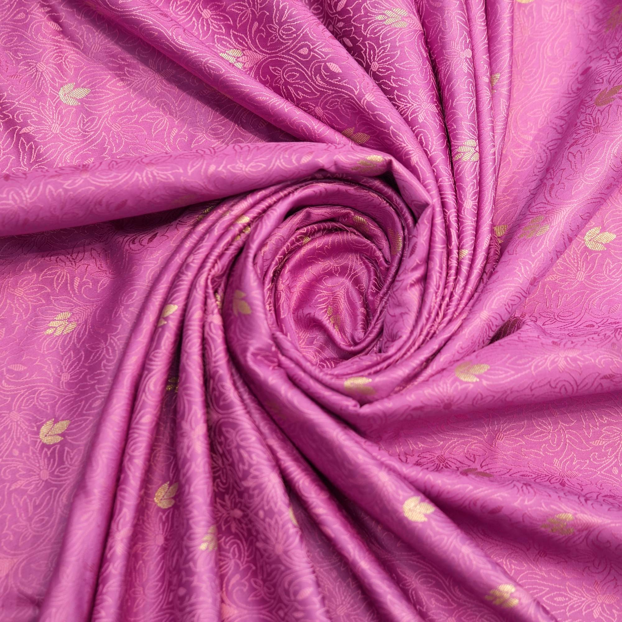 Magenta jamawar silk fabric with golden zari buti and intricate woven base texture