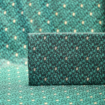 Emerald green jamawar silk fabric with gold floral zari buti and intricate vine pattern