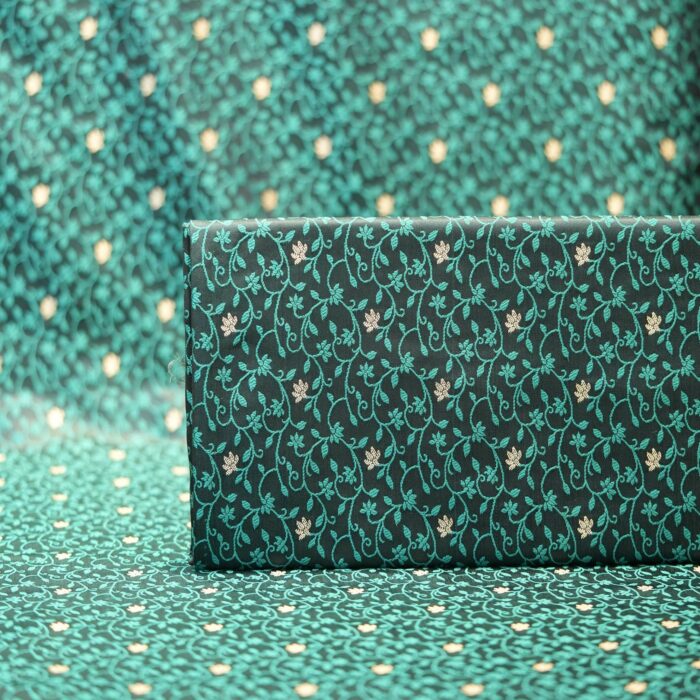 Emerald green jamawar silk fabric with gold floral zari buti and intricate vine pattern