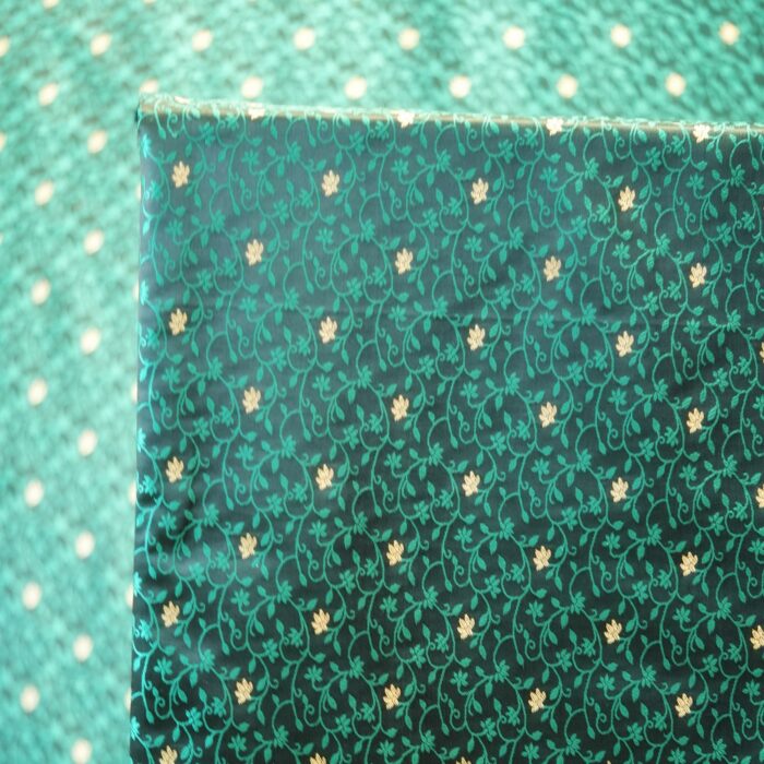 Emerald green jamawar silk fabric with gold floral zari buti and intricate vine pattern