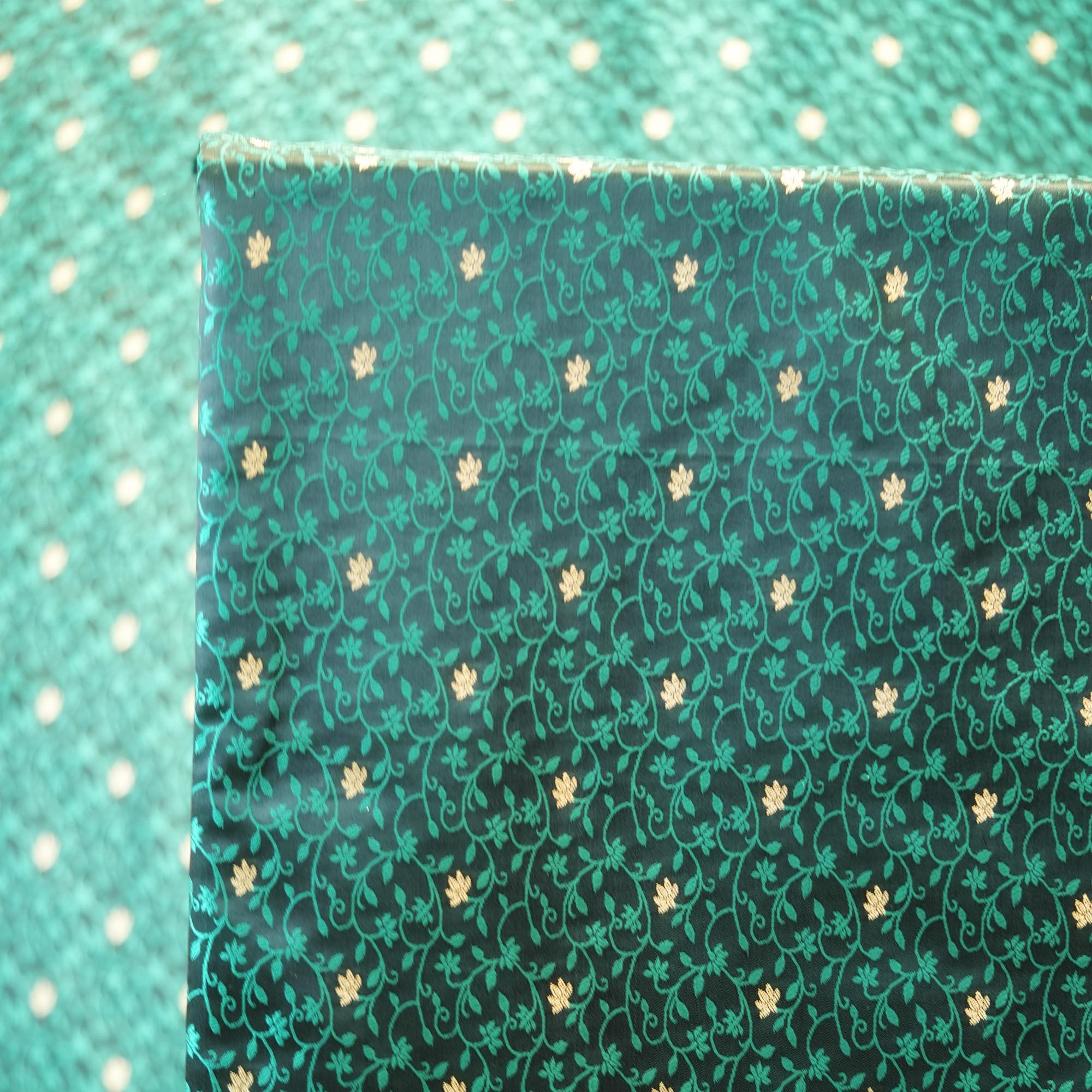 Emerald green jamawar silk fabric with gold floral zari buti and intricate vine pattern