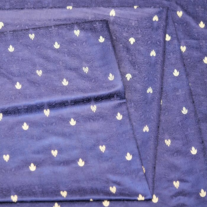 Midnight blue jamawar silk fabric with gold floral zari buti and embossed jacquard pattern
