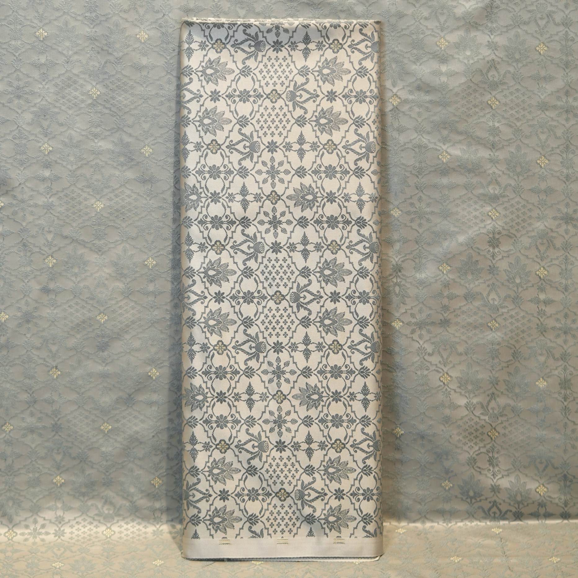 Silver grey jamawar silk fabric with bold contrast zari buti