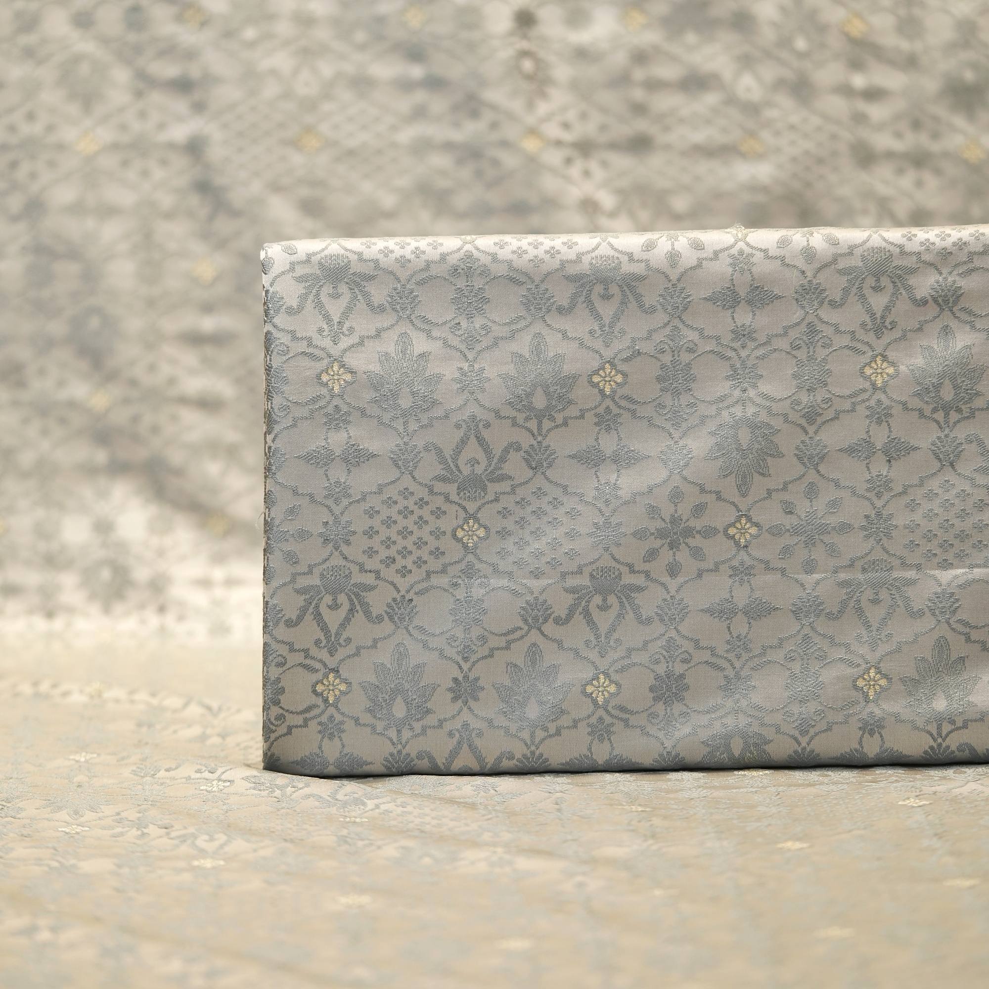 Silver grey jamawar silk fabric with bold contrast zari buti