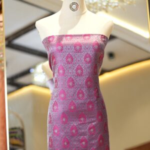 Pink tanchoi silk fabric with intricate jaal weave and subtle golden zari buti