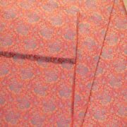 Tanchoi resham silk fabric with intricate floral weaving in crimson, lavender, and gold