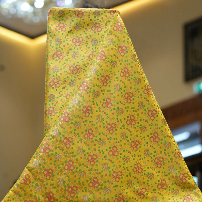 Lime yellow Resham silk fabric with floral motif and delicate multicolor weave