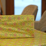 Lime yellow Resham silk fabric with floral motif and delicate multicolor weave
