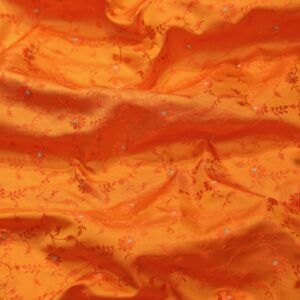 Handloom Tanchoi Jamawar silk in orange with Zari buti and woven floral pattern
