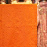 Handloom Tanchoi Jamawar silk in orange with Zari buti and woven floral pattern