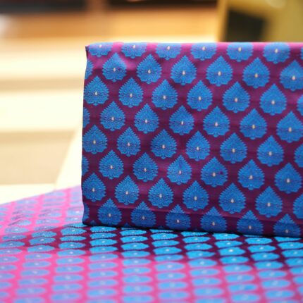 Pure handloom Tanchoi Jamawar resham silk fabric with Mughal blue leaf motifs on deep magenta base