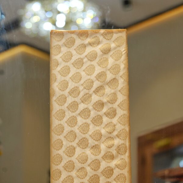 Pure handloom Tanchoi Jamawar resham silk fabric with Mughal leaf motifs in ivory and golden tones