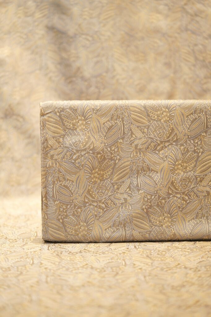 Pure Tanchoi floral jamawar handloom silk fabric in soft gold with intricate zari detailing