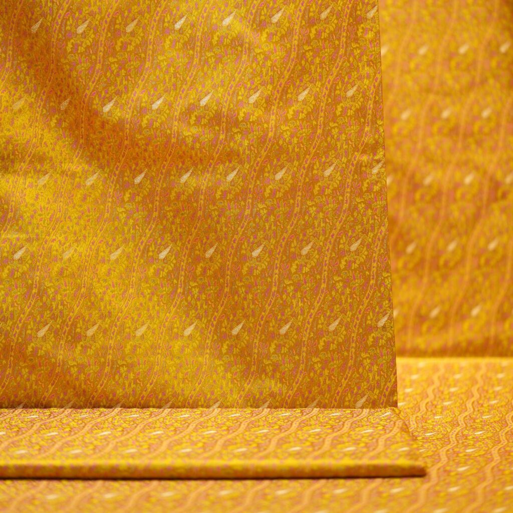 Golden Tanchoi jamawar silk fabric with diagonal Zari buta on pure kataan silk