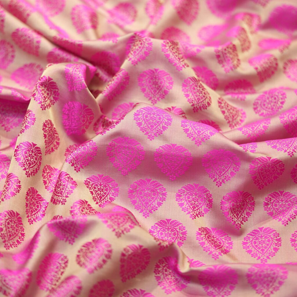 Beige and pink Tanchoi jamawar handloom kataan silk fabric with Mughal-inspired leaf pattern