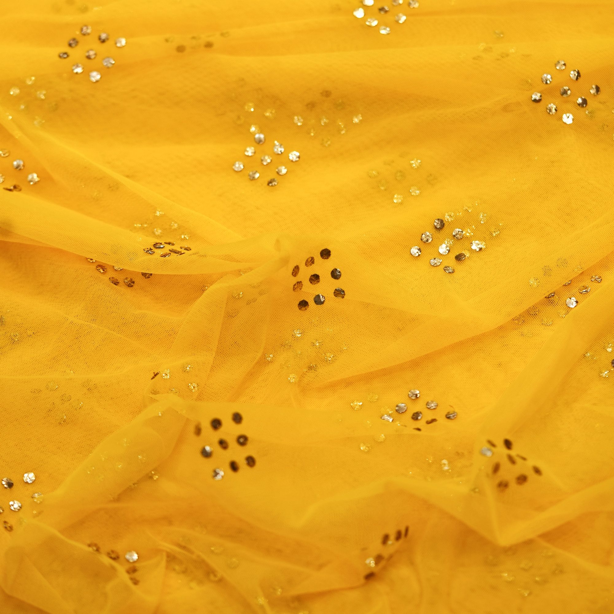 Yellow net fabric with gold mukaish diamond-shaped bootis