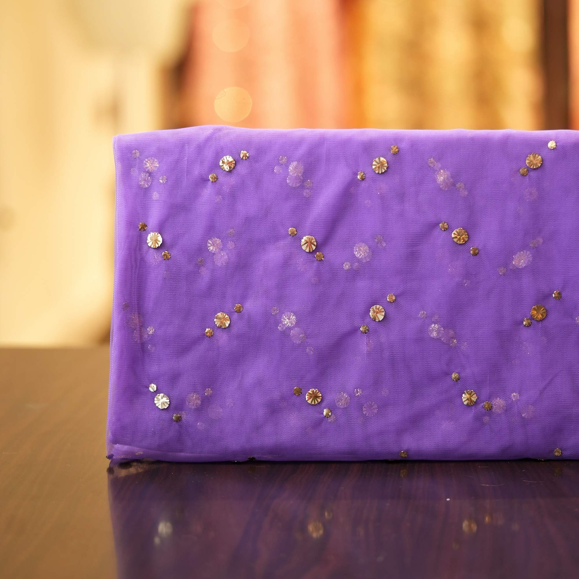 Purple net fabric with gold and silver Mukaish work in swirl dot pattern