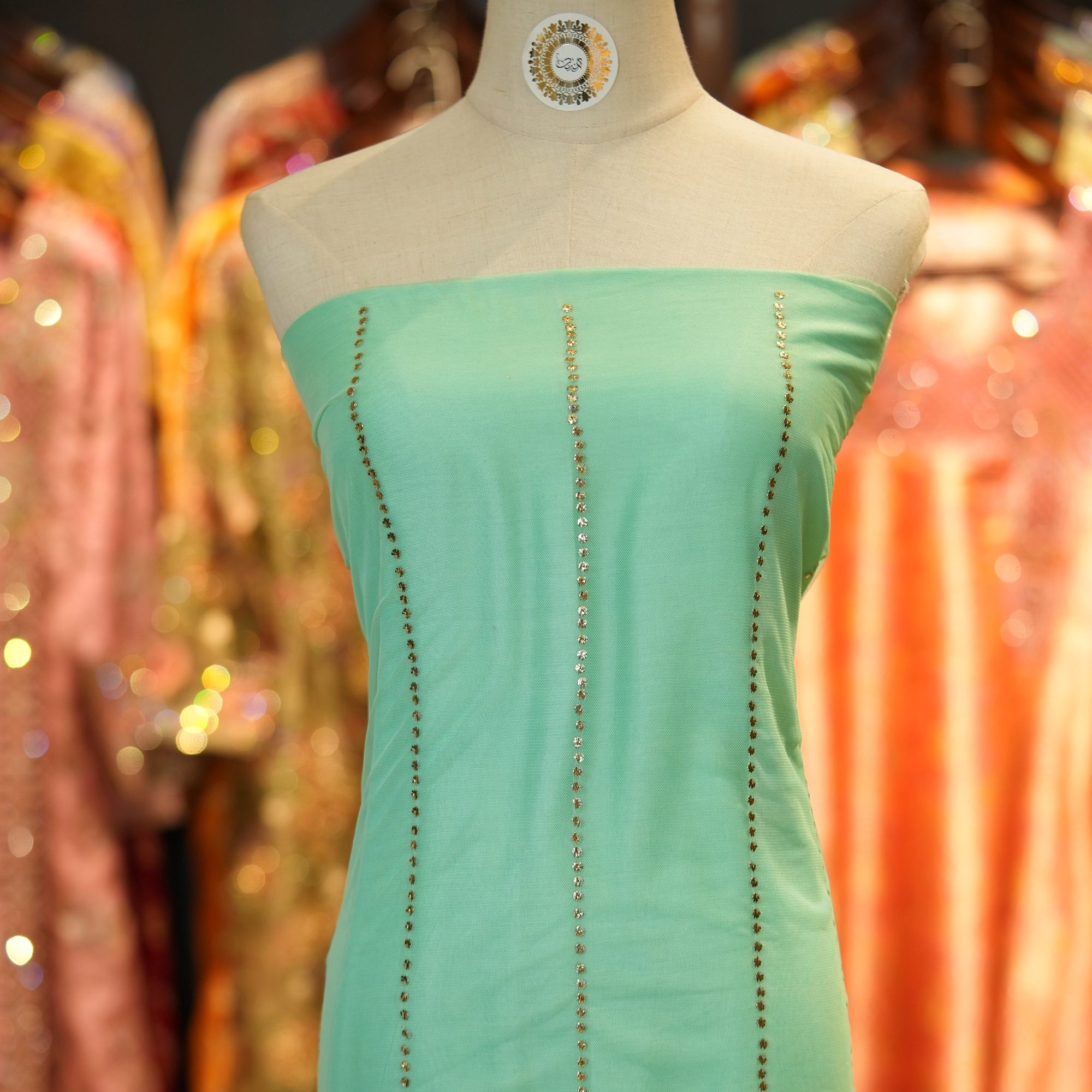 Mint green net fabric with vertical hand mukaish embroidery