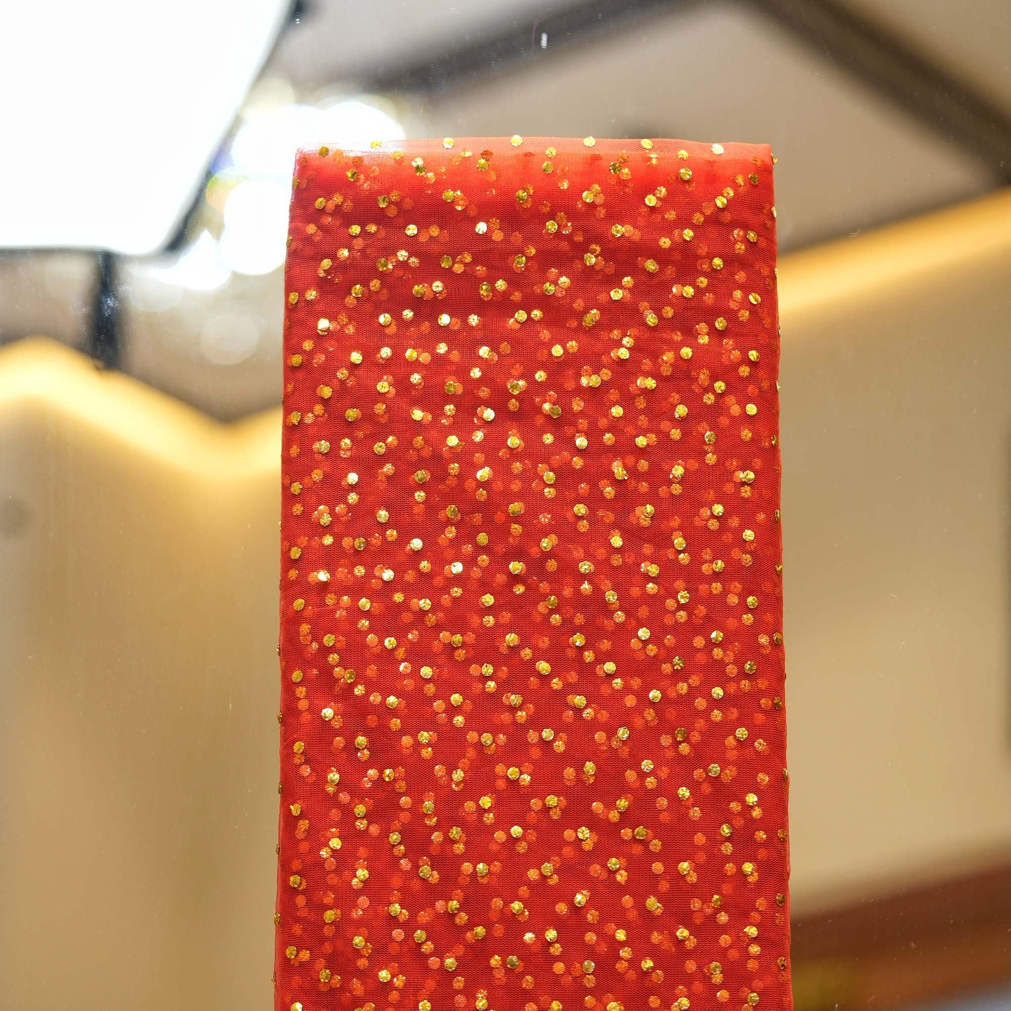 Red net fabric with dense gold mukaish work