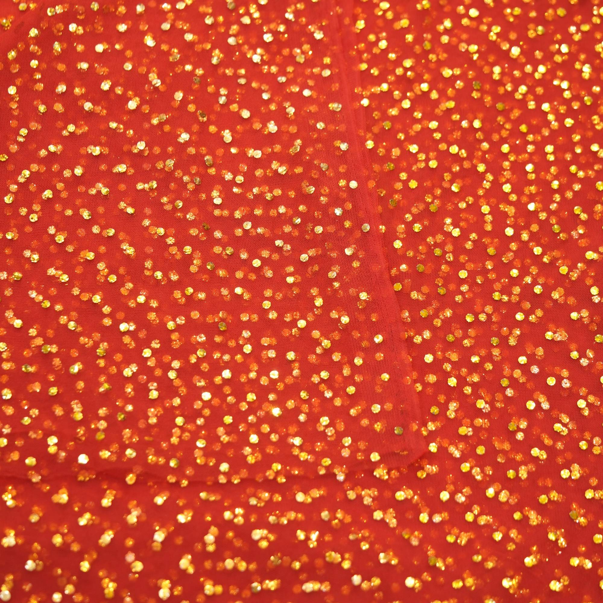 Pure net fabric in a striking red shade adorned with heavy gold mukaish work—perfect for layering over garments, thobes, scarves, and couture creations.
